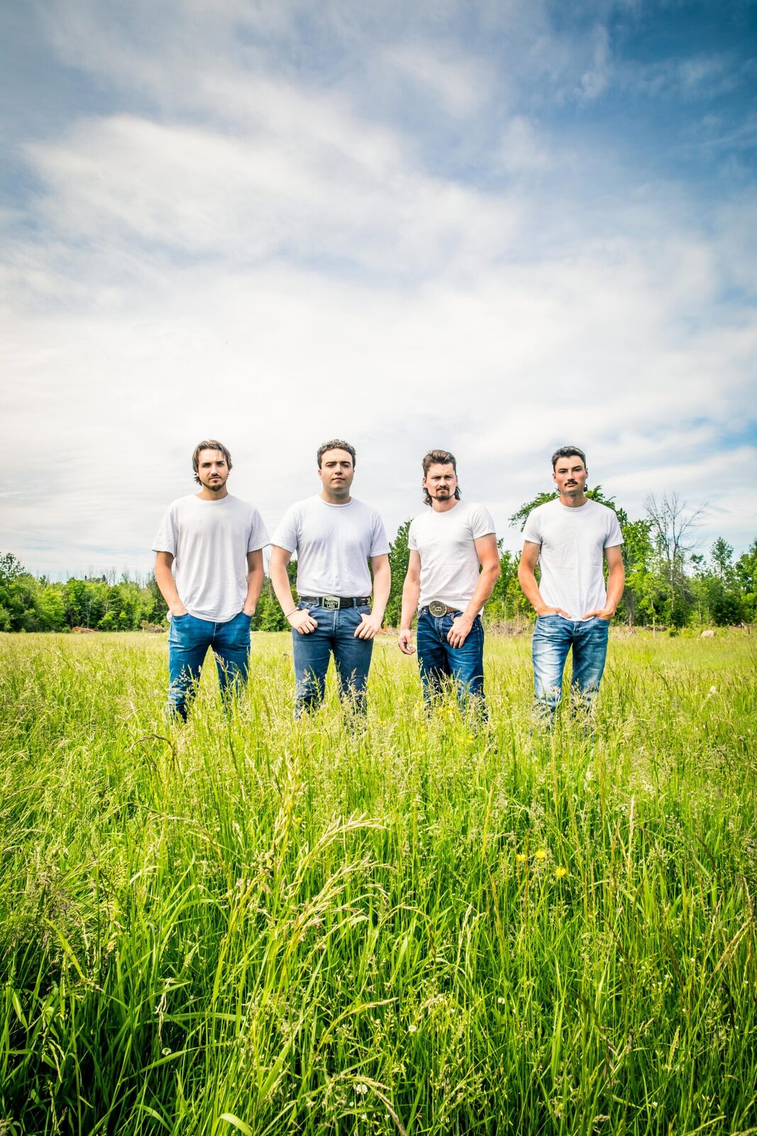 The County Lads walking through tall grass, photographed by AlZon Photography